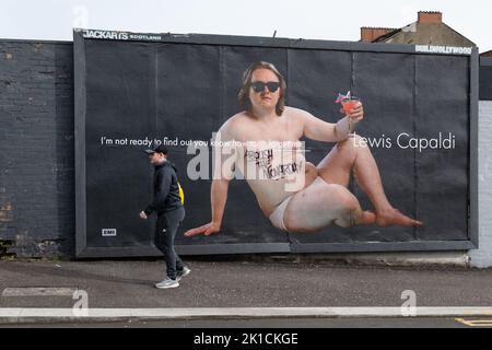 Glasgow, Scotland, UK - Abolish the Monarchy graffiti on Lewis Capaldi billboard Credit: Kay Roxby/Alamy Live News Stock Photo