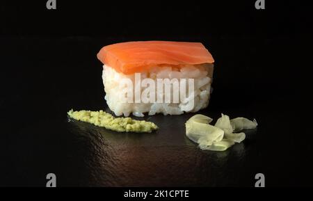 Smoked Salmon Nigiri sushi with wasabi and pickled ginger Stock Photo
