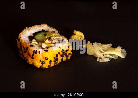 California roll with a sesame seed and pumpkin powder coating Stock Photo
