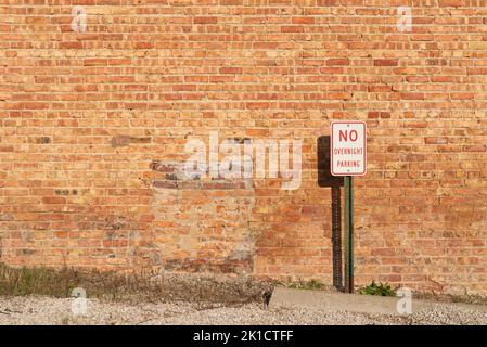 Brick wall in small town on a sunny afternoon. Stock Photo