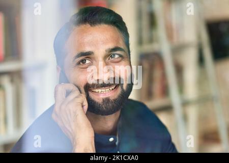 Happy indian business man working talking on phone making call, closeup. Stock Photo