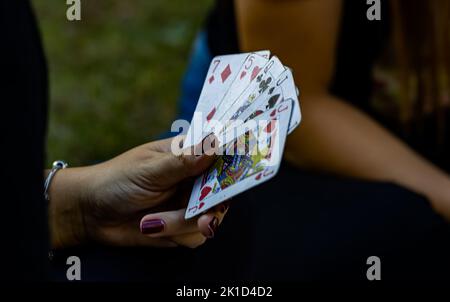 Couple playing card in the par Stock Photo