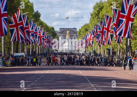 London, UK. 17th Sep, 2022. A view of The Mall lined with Union Jacks, as large crowds continue to gather around Buckingham Palace. The Queen's funeral takes place on 19th September. Stock Photo