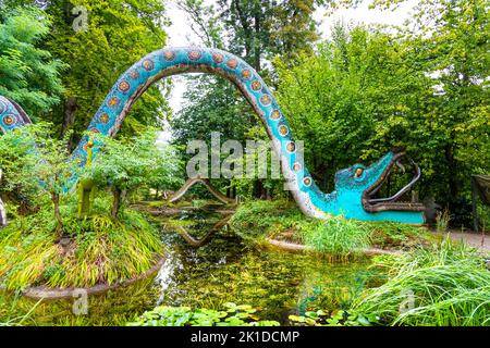Snake bridges covered with mosaic over the pond in the magic forest at Bruno Weber Park, Dietikon, Switzerland Stock Photo
