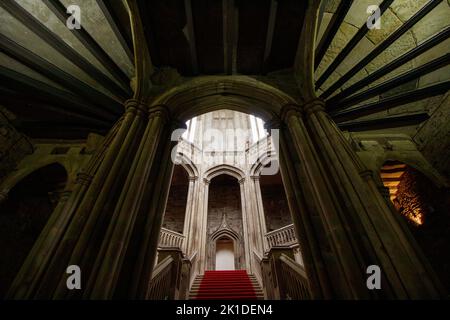 The main staircase inside Margam Castle, a Tudor Gothic mansion house built by Christopher Rice Mansel Talbot in the early nineteenth century. Stock Photo