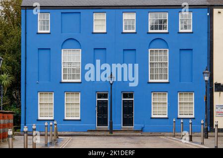 A blue painted house standing in Somerset Place, Swansea, Wales, UK Stock Photo