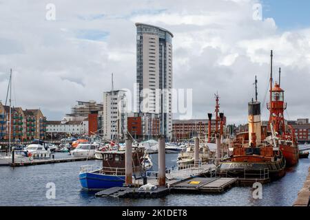 The Trinity House Lightship 91 Helwick moored along with Boats and yachts in Swansea Basin. Stock Photo