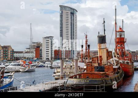 The Trinity House Lightship 91 Helwick moored along with Boats and yachts in Swansea Basin. Stock Photo