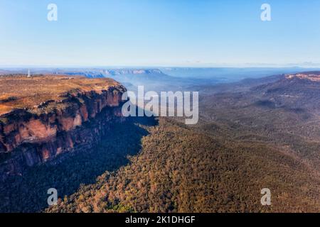 Cliff edges of sandstone rocks in Blue Mountain national park of Australia - aerial landscape. Stock Photo