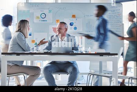 Team, workers or employee busy collaboration and planning a business growth strategy together in an office. Happy corporate professional working on a Stock Photo
