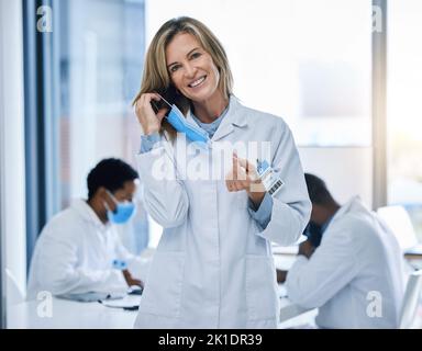 Doctor removing covid face mask after end of pandemic, happy after surgery success and freedom from virus. Face portrait of healthcare person and Stock Photo