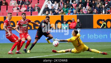 Augsburg. 17th Sep, 2022. Jamal Musiala (2nd R) of Bayern Munich shoots during the German first division Bundesliga football match between FC Augsburg and Bayern Munich in Augsburg, Germany, Sept.17, 2022. Credit: Philippe Ruiz/Xinhua/Alamy Live News Stock Photo