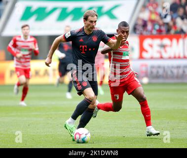 Augsburg. 17th Sep, 2022. Leon Goretzka (L) of Bayern Munich breaks through during the German first division Bundesliga football match between FC Augsburg and Bayern Munich in Augsburg, Germany, Sept.17, 2022. Credit: Philippe Ruiz/Xinhua/Alamy Live News Stock Photo