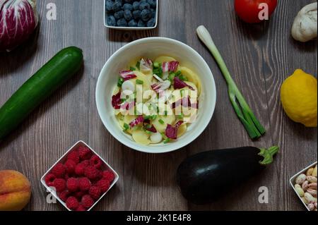 Flat lay of various fruits and vegetables on wooden table Stock Photo