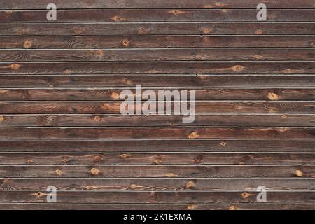 Wooden dark brown fence or wall from horizontal boards Stock Photo