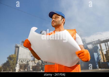 Young foreman working at construction material factory Stock Photo