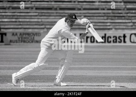 Mike Denness batting for Essex; Warwickshire vs Essex, Schweppes County Championship, at Edgbaston Cricket Ground, Birmingham, England 2,4 & 5 July 1977.   Mike Denness was a former Captain of the England Cricket Team, including, notably the unsuccessful tour to Australia in 1974/5. He is here wearing his MCC cap. Stock Photo