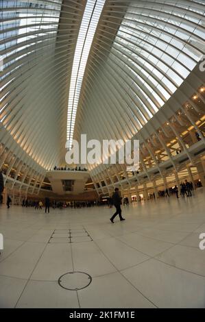 a vertical shot of people on the stairs of the Westfield World Trade Center in New York, Oculus Center Stock Photo