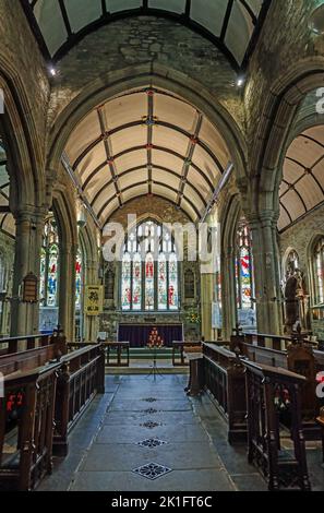 Candles before the altar at Tavistock Parish Church. One of only three English churches dedicated to St Eustachius. The candles in memory of Queen Eli Stock Photo