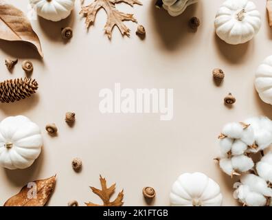 Fall composition with different leaves, pumpkins, acorns on beige background. Autumn, fall, halloween, thanksgiving day concept. Flat lay, top view, c Stock Photo