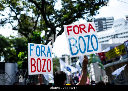 Brazilians protest carrying posters against the government of President Jair Bolsonaro in the city of Sal Stock Photo