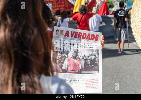 Brazilians protest carrying posters against the government of President Jair Bolsonaro in the city of Sal Stock Photo