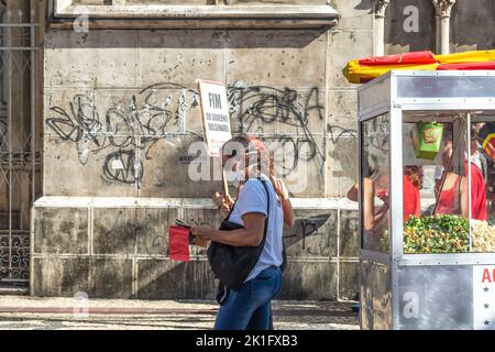 Brazilians protest carrying posters against the government of President Jair Bolsonaro in the city of Sal Stock Photo