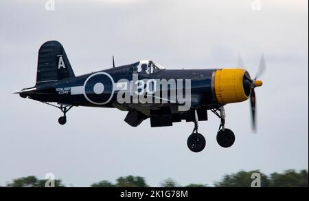 Goodyear Corsair FG-1D (G-FGID) landing at dusk, after it's flying display at the IWM Duxford Battle of Britain Airshow 10th September 2022 Stock Photo