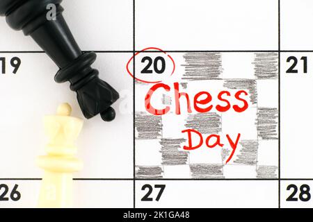 A Reminder Chess Day in the calendar with black and white chess pieces on it. July 20. Stock Photo