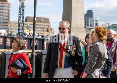 London, UK. 15th Sep, 2022. Man with medals and union flag waistcoat waits in a queue on Lamberth Bridge to view The Queen's coffin. Large crowds of mourners visit Westminster Hall to view the Queen's coffin. (Credit Image: © Ian Davidson/SOPA Images via ZUMA Press Wire)