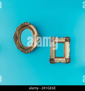 Vintage ornamental photo and picture frame on blue background. Minimal concept. Stock Photo