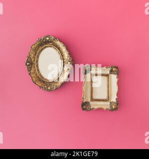 Vintage ornamental photo and picture frame on pink background. Minimal concept. Stock Photo