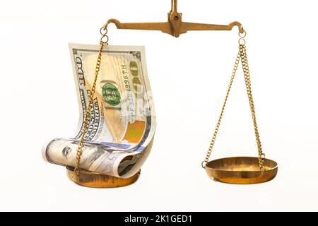 American 100 Dollars Lying on a Scale, Currency Value Concept, Exchange Rates, Strength and Value of US Money, World Currency, White Background Stock Photo