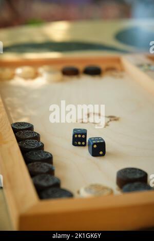 cubes on a backgammon board Stock Photo