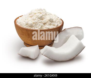 Wooden bowl full of coconut flour isolated on white Stock Photo