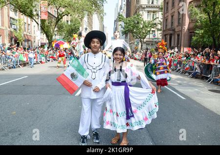 Participants are posing for a photo on Madison Avenue, New York City during the Mexican Day Parade on Sept 18, 2022. Stock Photo