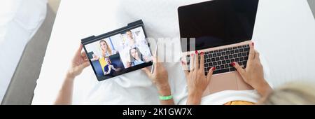 Man and woman remotely communicate with business partners Stock Photo
