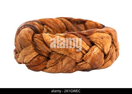 Dried melon in the shape of a pigtail on a white background. Dried melon fruit isolateDried melon in the shape of a pigtail on a white background. Dri Stock Photo