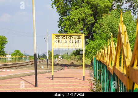 Railway sign board at railway station platform of mountain village Kalakund near Mhow, Indore, Madhya Pradesh on a sunny summer day. Indian village. Stock Photo