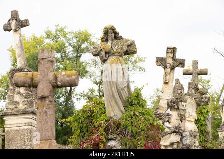 Old cemetery of Polish Jews in Ukraine. Ancient abandoned graves. Cemetery sculpture of the 18th and 19th centuries,Cemetery in Ukraine Stock Photo