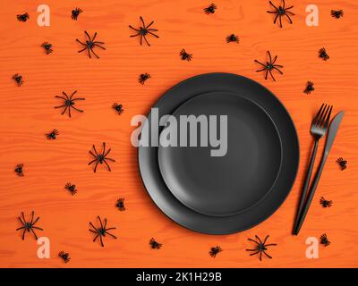 Halloween table setting with black cutlery and spiders on orange wooden background. Serving with an empty black plate for design. Copy space, top view Stock Photo