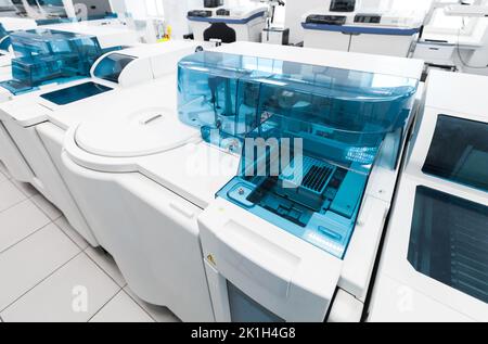 Blood tests pre-analytical system fragment. Clinical laboratory and blood bank fully automated equipment is in a white lab room Stock Photo