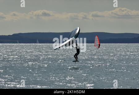 Windsurfing Water Sport - Surfers Completing The Sport On Hayling Island Beachfront Stock Photo