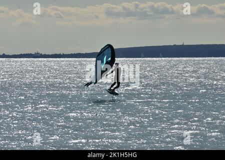 Windsurfing Water Sport - Surfers Completing The Sport On Hayling Island Beachfront Stock Photo