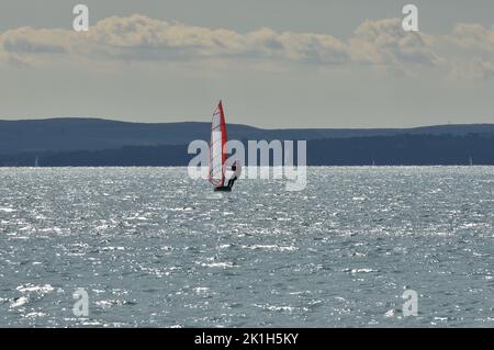 Windsurfing Water Sport - Surfers Completing The Sport On Hayling Island Beachfront Stock Photo