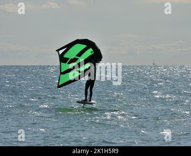 Windsurfing Water Sport - Surfers Completing The Sport On Hayling Island Beachfront Stock Photo