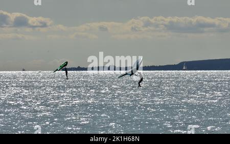 Windsurfing Water Sport - Surfers Completing The Sport On Hayling Island Beachfront Stock Photo