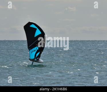 Windsurfing Water Sport - Surfers Completing The Sport On Hayling Island Beachfront Stock Photo