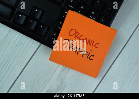 Concept of Organic Traffic write on sticky notes isolated on Wooden Table. Stock Photo