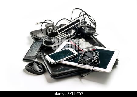 Damaged or old used electronics gadgets for daily use on white background,  Reuse and Recycle concept, Top view. Stock Photo